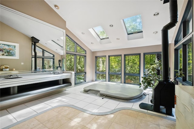 bathroom featuring lofted ceiling and tile patterned flooring