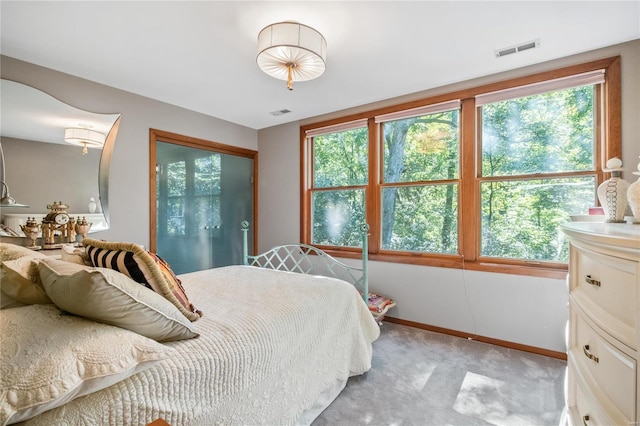 bedroom with light colored carpet