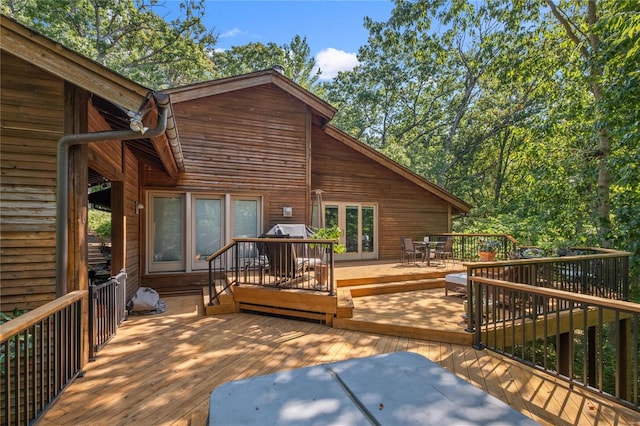 wooden terrace with a grill