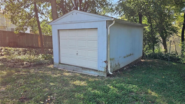 garage featuring a yard