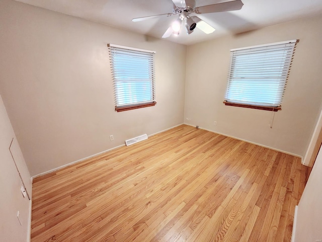 unfurnished room with ceiling fan and light hardwood / wood-style flooring