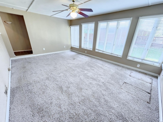 spare room with carpet flooring and ceiling fan