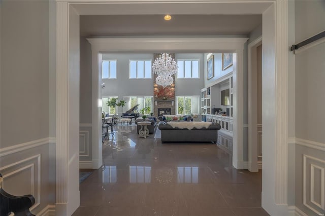 hall with a barn door and a high ceiling