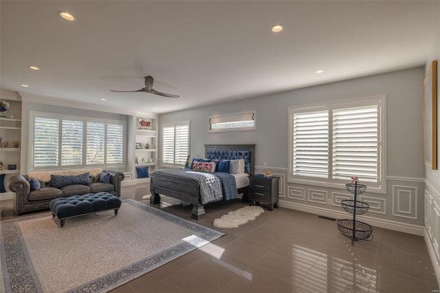 tiled bedroom with multiple windows and ceiling fan