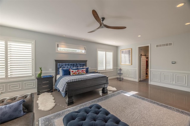 tiled bedroom with ceiling fan