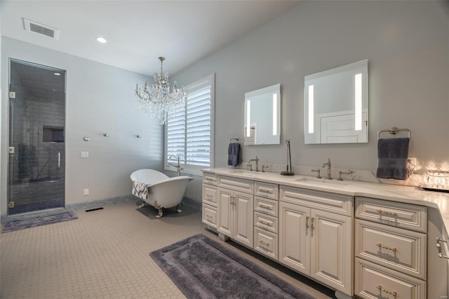 bathroom featuring vanity, a chandelier, and plus walk in shower