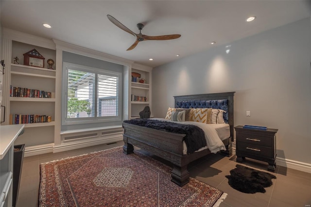 bedroom with ceiling fan and tile patterned floors