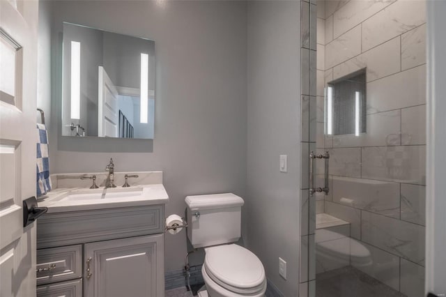 bathroom with walk in shower, vanity, and toilet