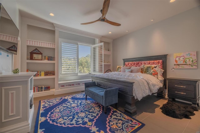 bedroom with ceiling fan and hardwood / wood-style flooring