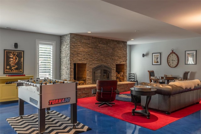 game room featuring a fireplace