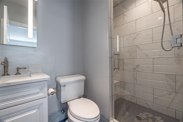 bathroom with vanity, a shower with shower door, and toilet