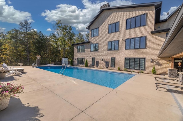 view of pool featuring a patio