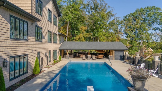 view of swimming pool featuring a patio area