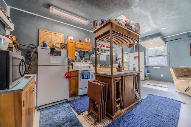 kitchen with white appliances and a kitchen island