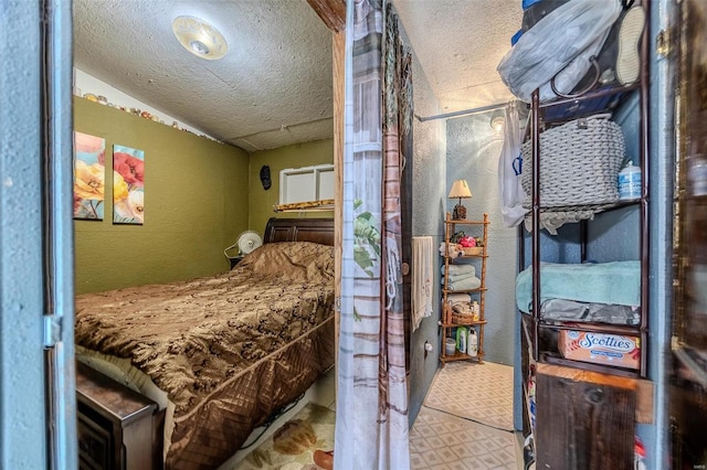 bedroom with a textured ceiling and vaulted ceiling