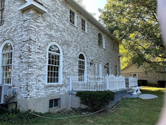 view of home's exterior featuring a lawn