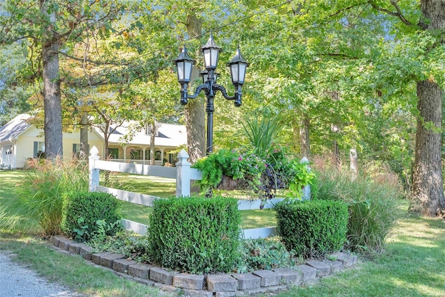 exterior space featuring a lawn and fence