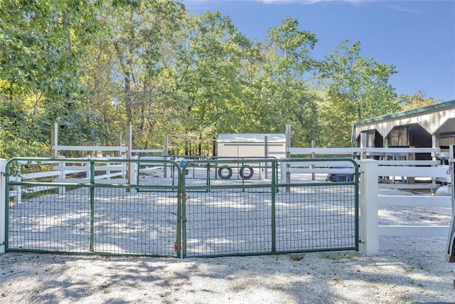 view of gate with an exterior structure and an outbuilding