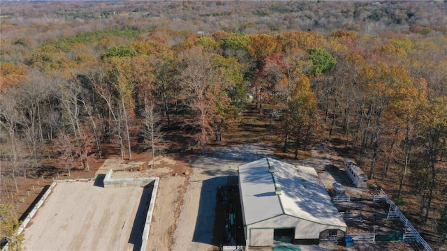 birds eye view of property featuring a view of trees