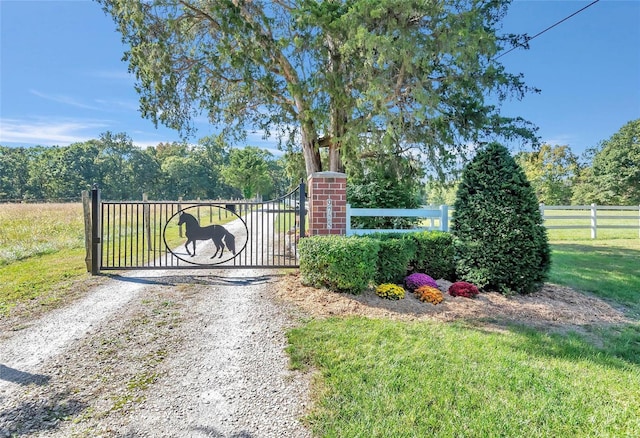 view of gate with fence