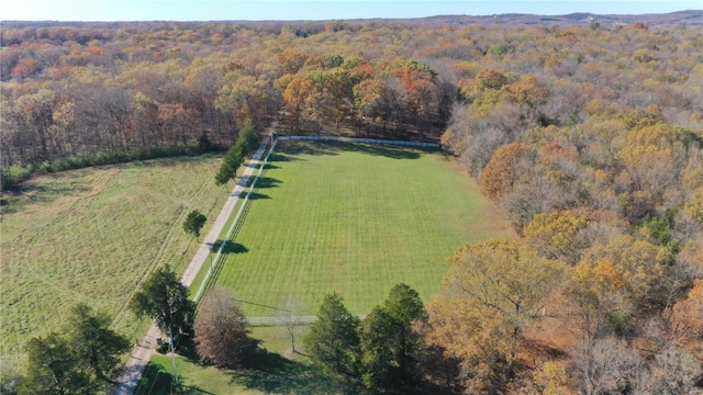 aerial view with a rural view and a wooded view