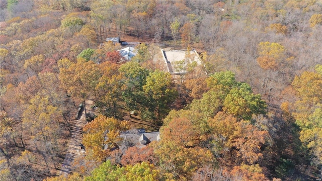 drone / aerial view featuring a view of trees