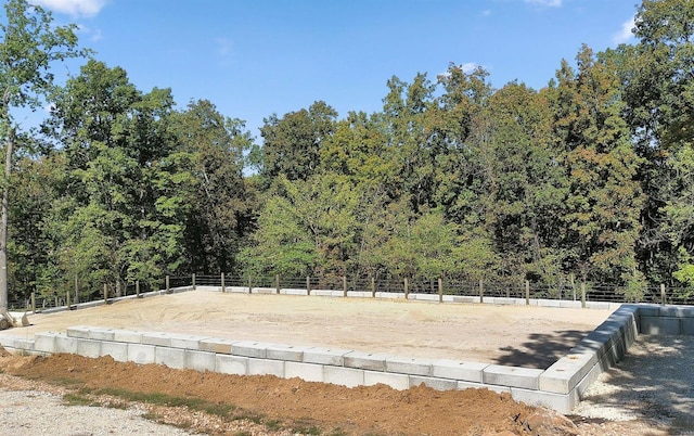 view of yard with fence and an enclosed area