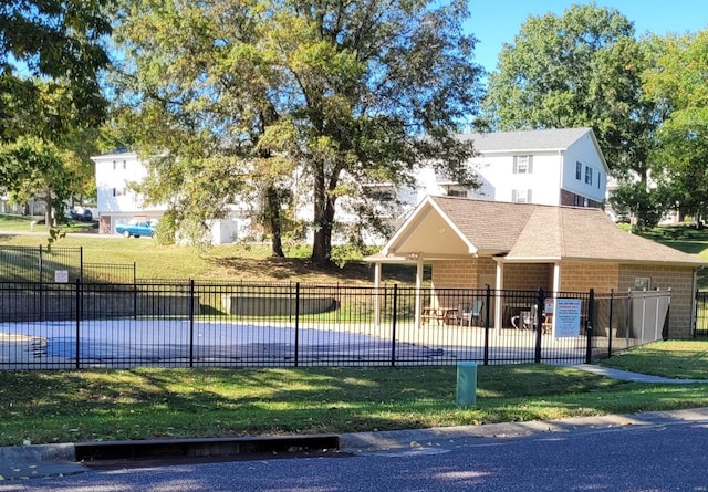 view of home's community featuring a lawn