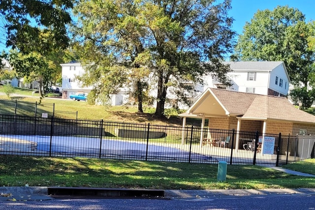 view of swimming pool featuring a lawn