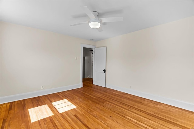 spare room featuring ceiling fan and light hardwood / wood-style flooring