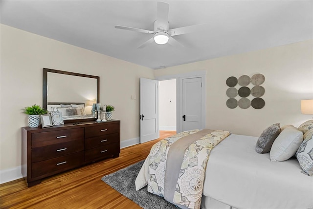 bedroom featuring hardwood / wood-style flooring and ceiling fan