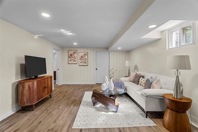 living room with light hardwood / wood-style flooring