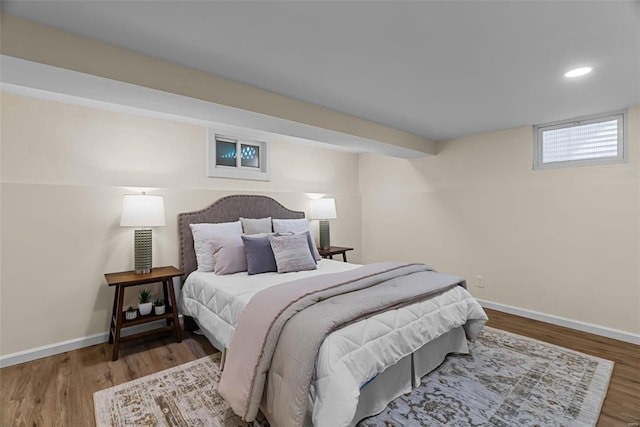 bedroom with hardwood / wood-style floors