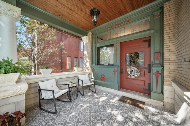 property entrance featuring a porch