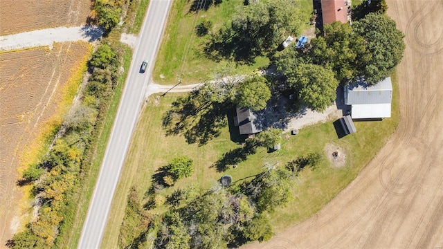 birds eye view of property with a rural view