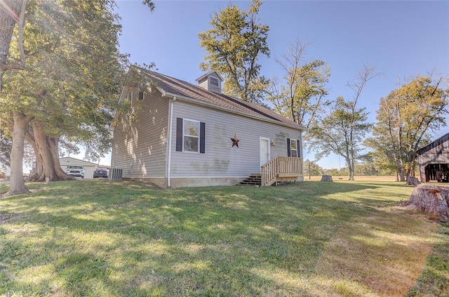 view of side of home with a lawn