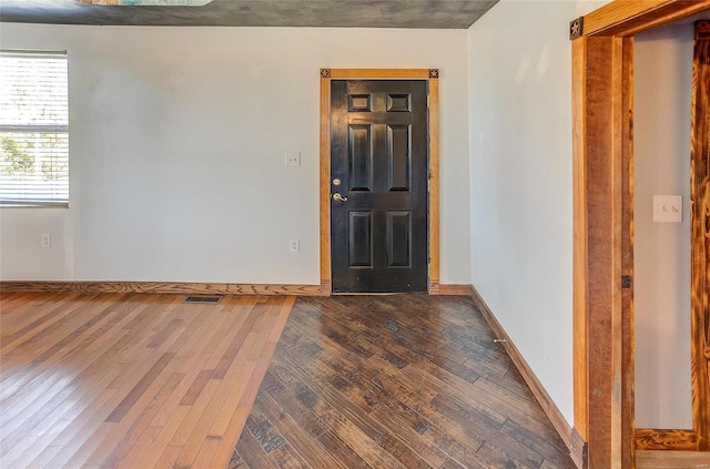 entrance foyer featuring dark hardwood / wood-style floors