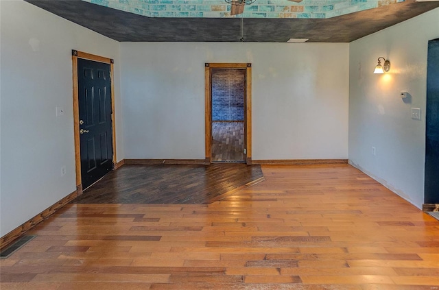 empty room with light hardwood / wood-style floors