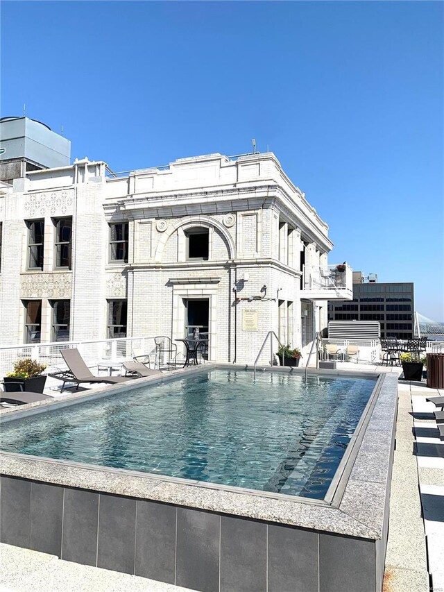 view of swimming pool with a patio area