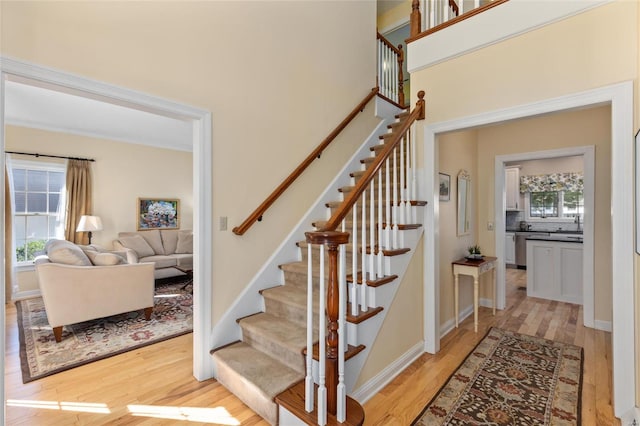 stairs featuring wood-type flooring