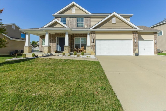 craftsman-style house featuring a porch, a garage, and a front lawn