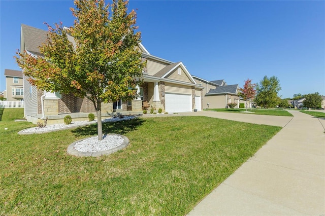 view of front of property featuring a garage and a front yard