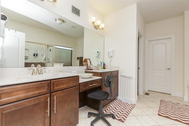 bathroom featuring vanity, tile patterned floors, and walk in shower