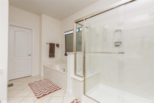 bathroom featuring tile patterned flooring and plus walk in shower