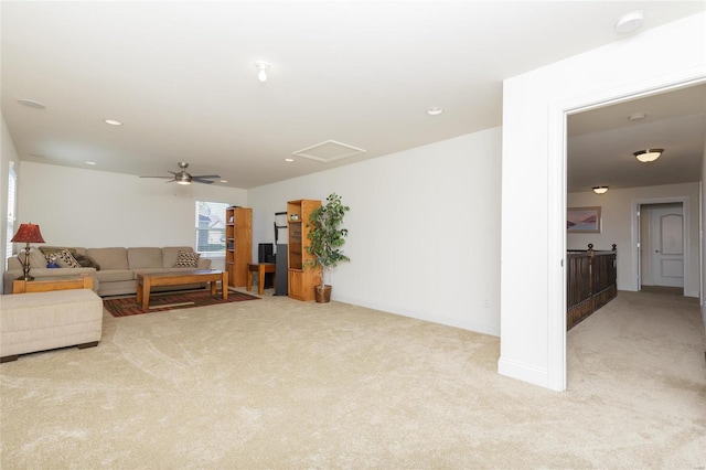 living room with ceiling fan and light carpet