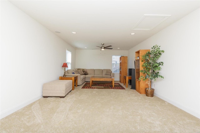 living room with light carpet and ceiling fan