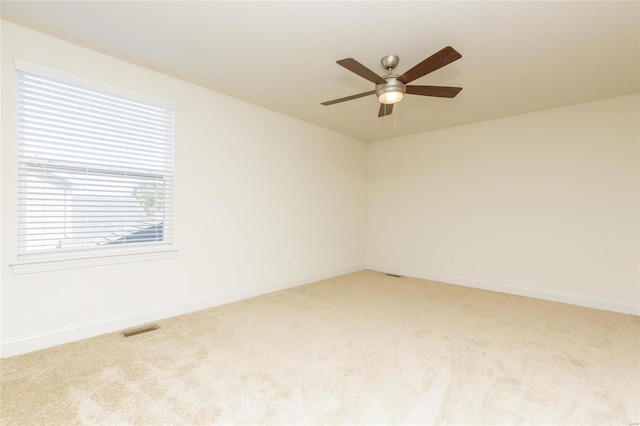 carpeted empty room with ceiling fan