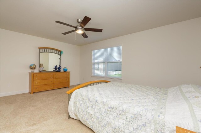 bedroom with ceiling fan and carpet flooring