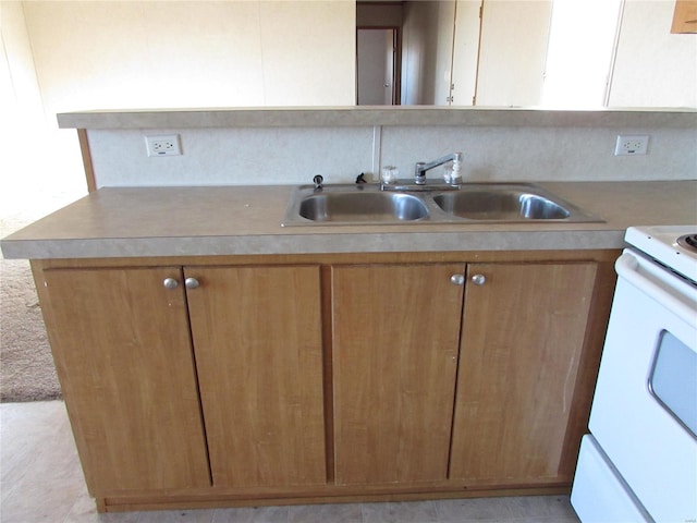 kitchen with white electric range and sink