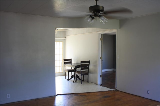 dining area with ceiling fan and hardwood / wood-style flooring